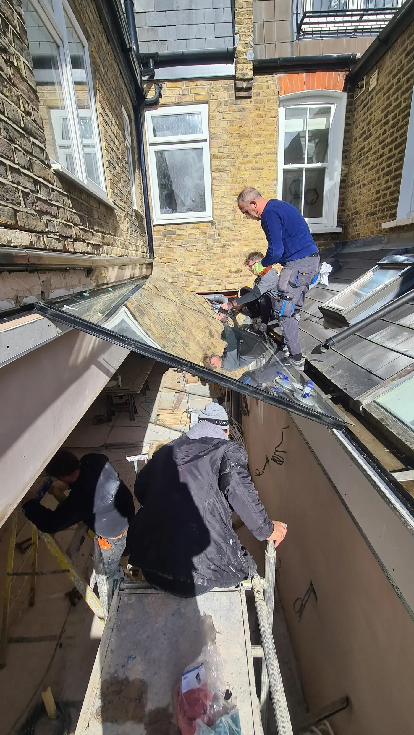 Lifting in a new skylight in SW3