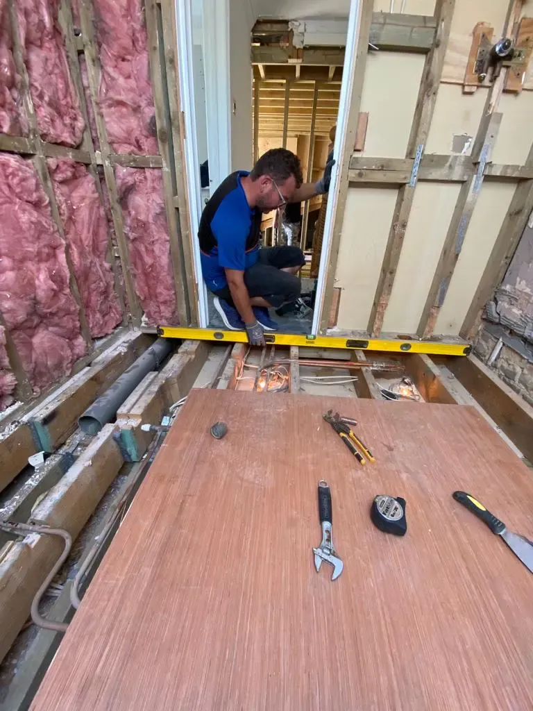 Bathroom stripped back to the joists in W14